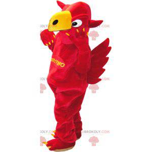 Mascot red and yellow griffin with wings in the back -