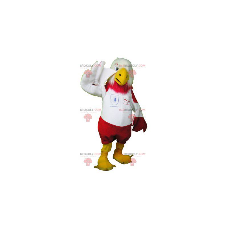 Mascotte d'aigle rouge et blanc en tenue de sport -