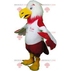 Mascotte d'aigle rouge et blanc en tenue de sport -