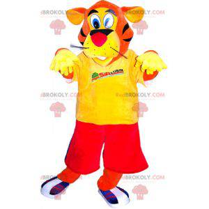 Mascota tigre naranja vestida de rojo y amarillo -