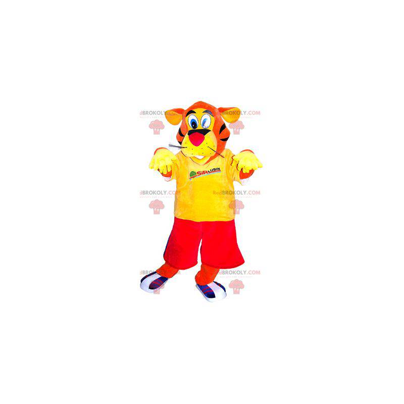 Mascotte de tigre orange habillé en rouge et jaune -