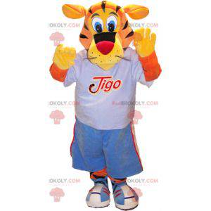 Mascote tigre Tigo laranja e amarelo em roupas esportivas azuis