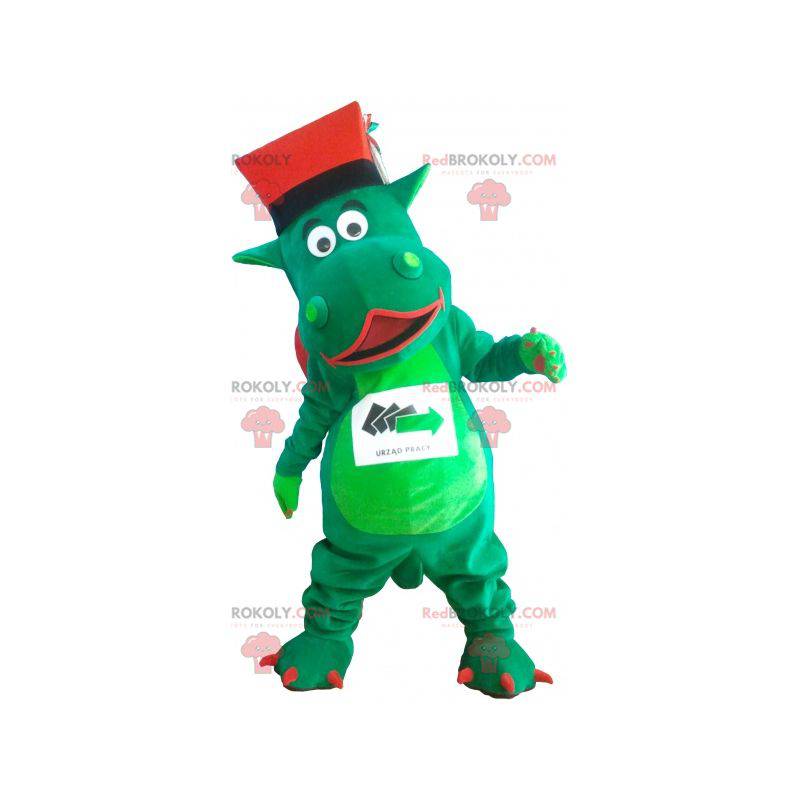 Mascotte de dinosaure géant vert avec un chapeau -