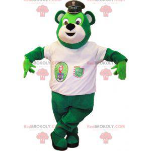 Grünes Teddybärmaskottchen mit einem weißen T-Shirt -