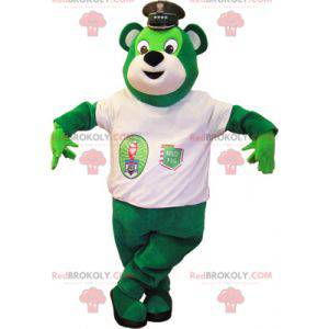 Mascotte de nounours vert avec un tee-shirt blanc -