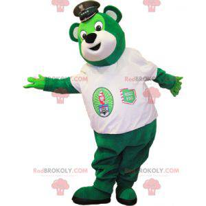 Mascotte verde dell'orsacchiotto con una maglietta bianca -