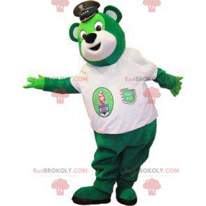 Grünes Teddybärmaskottchen mit einem weißen T-Shirt -