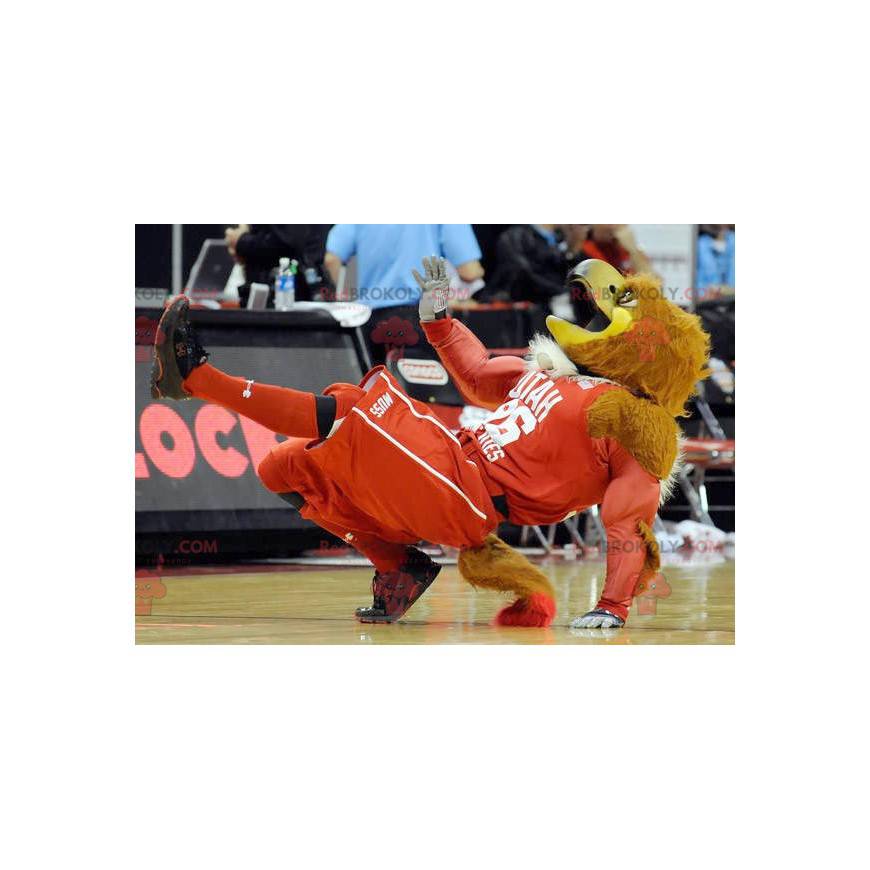Brown and yellow muscular eagle mascot in sportswear - Brown and yellow muscular eagle mascot in sportswear -