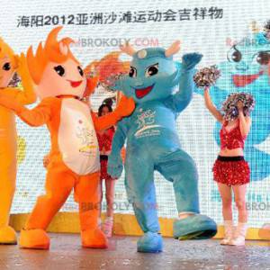 3 mascots of very colorful orange, yellow and blue snowmen -