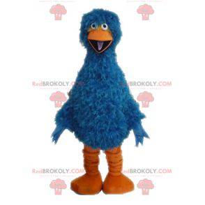 Haariges und lustiges blaues und orange Vogelmaskottchen -