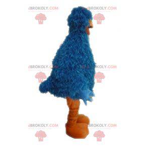 Harige en grappige blauwe en oranje vogelmascotte -