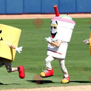 3 mascotes um sanduíche uma bebida e um cilindro amarelo -