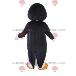 Mascota de pingüino blanco y negro con pajarita - Redbrokoly.com