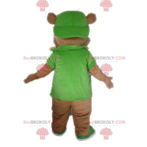 Obří medvěd hnědý maskot oblečený v zelené barvě -