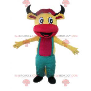 Gul og lyserød ko-maskot med overall - Redbrokoly.com