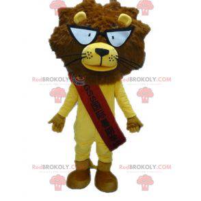 Mascote leão amarelo e marrom com óculos - Redbrokoly.com