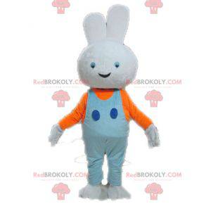 Mascotte de lapin blanc avec une salopette bleue -
