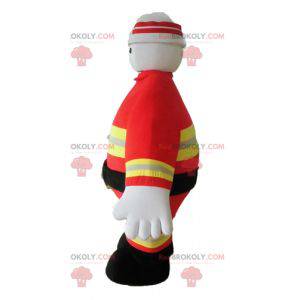 Mascotte pompiere in uniforme arancione e gialla -