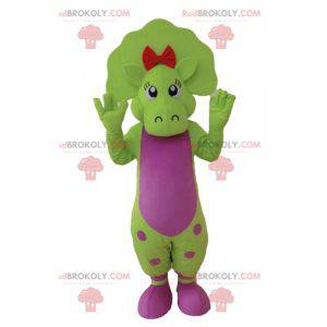 Mascote dinossauro verde e rosa com pontos - Redbrokoly.com