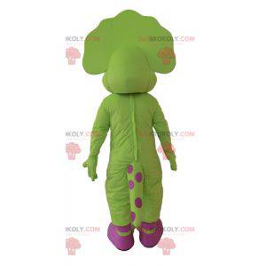 Mascote dinossauro verde e rosa com pontos - Redbrokoly.com