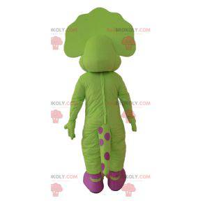 Mascote dinossauro verde e rosa com pontos - Redbrokoly.com