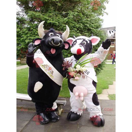 2 maskotar en svart tjur och en svartvit ko - Redbrokoly.com