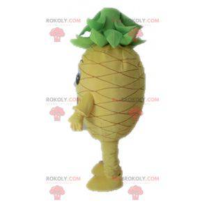 Gigantisk gul og grønn ananas maskot. Fruktmaskott -