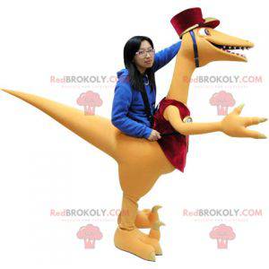 Mascote gigante de dinossauro laranja e vermelho -