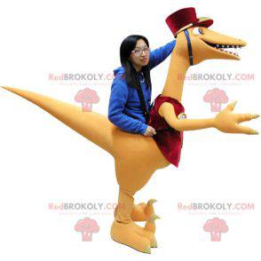 Mascote gigante de dinossauro laranja e vermelho -