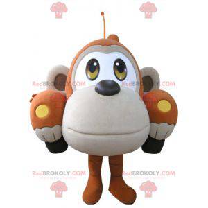 Car mascot shaped like an orange and beige monkey -