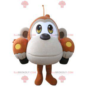 Car mascot shaped like an orange and beige monkey -