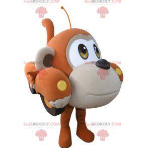 Car mascot shaped like an orange and beige monkey -