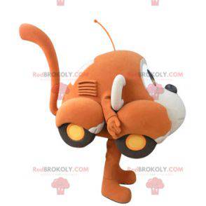 Car mascot shaped like an orange and beige monkey -