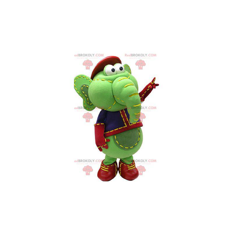 Green and yellow elephant mascot in blue and red outfit -