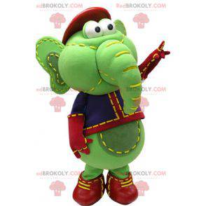Green and yellow elephant mascot in blue and red outfit -