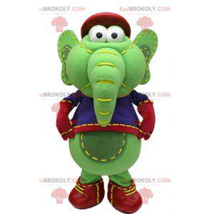 Groene en gele olifant mascotte in blauwe en rode outfit -