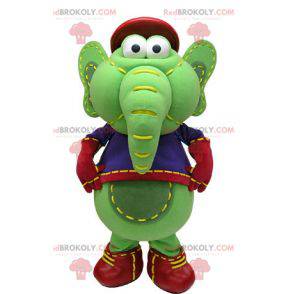 Green and yellow elephant mascot in blue and red outfit -