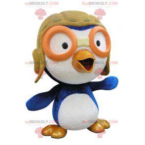 Mascotte uccello blu e bianco in abito da aviatore -