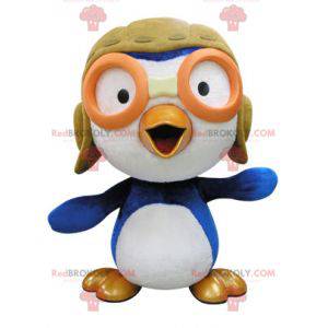 Mascotte uccello blu e bianco in abito da aviatore -