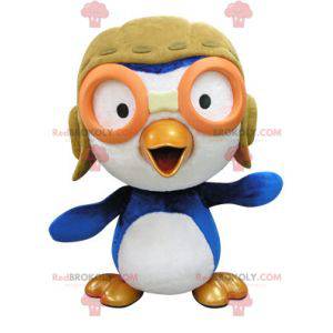 Mascotte uccello blu e bianco in abito da aviatore -