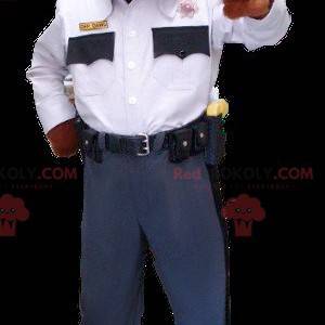 Brązowy i biały pies maskotka w mundurze policyjnym -