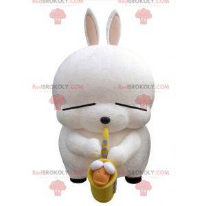 Mascotte grande coniglio bianco con un sassofono -