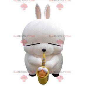 Grote witte konijn mascotte met een saxofoon - Redbrokoly.com