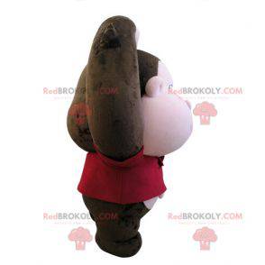 Mascota mono marrón y rosa con una cabeza grande -