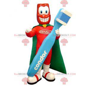 Mascota de superhéroe con un cepillo de dientes gigante -
