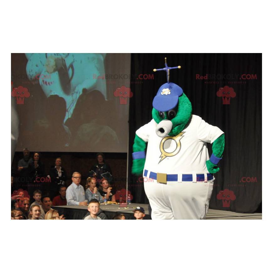 Big green alien mascot in white outfit - Redbrokoly.com
