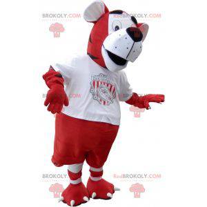 Mascotte de tigre en tenue de footballeur rouge et blanc -