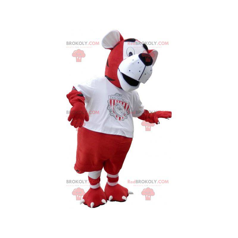 Mascotte de tigre en tenue de footballeur rouge et blanc -