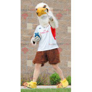 Giant brown and white eagle mascot in sportswear -