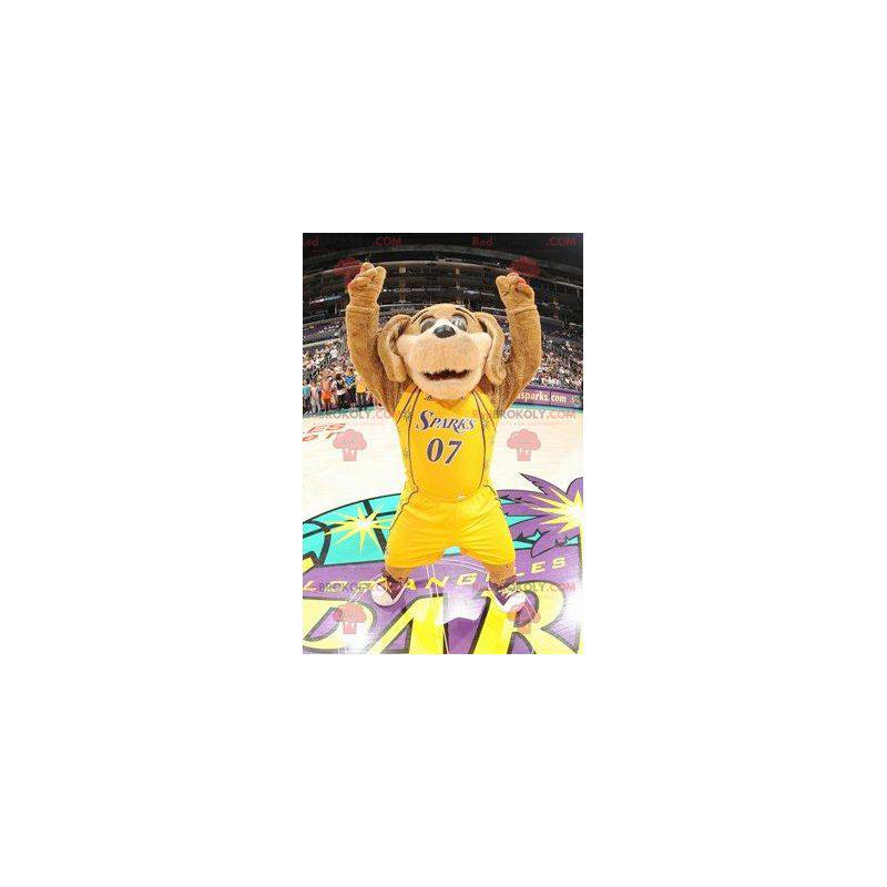 Hnědý pes maskot v žluté sportovní oblečení - Redbrokoly.com